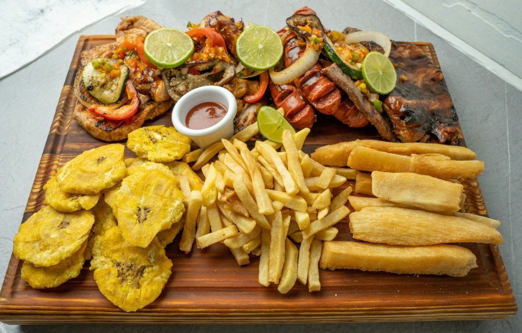 a wooden platter filled with different types of food