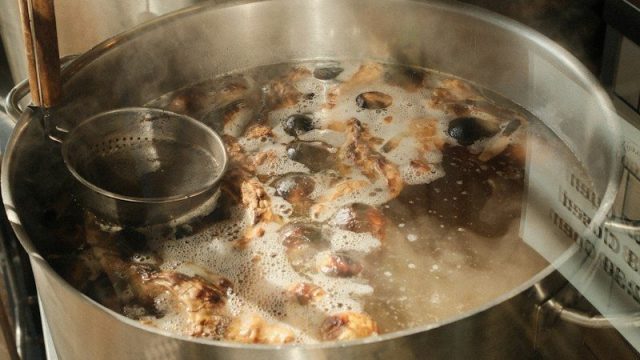 A large pot filled with food on top of a stove